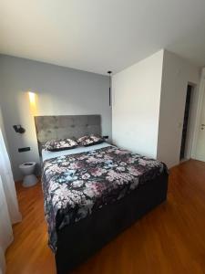 a bedroom with a large bed in a room at Room with jungle bathroom in Dubrovnik