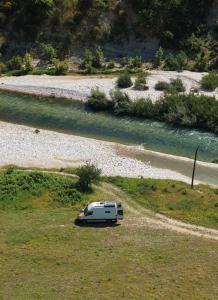 a white car parked on the side of a road at Sprinter Camper Albania Rental in Tirana +5 photos