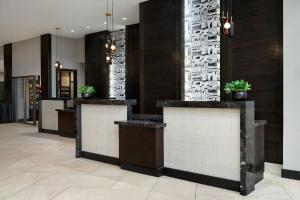 a lobby with a row of reception desks at Indianapolis Marriott East in Indianapolis