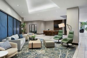 a living room with a couch and chairs and a table at Indianapolis Marriott East in Indianapolis