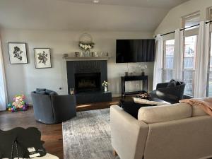 a living room with a couch and a fireplace at Rockwall Harbor Retreat in Rockwall
