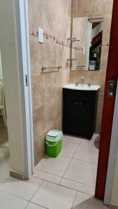a bathroom with a sink and a toilet at La Palmera in Chajarí +11 photos