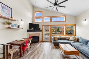 a living room with a couch and a table at La Riva Del Lago #204 in Dillon