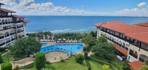 an aerial view of a resort with a swimming pool and the ocean at Panorama Sea View in Sveti Vlas