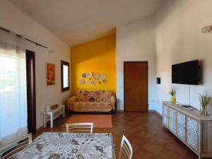 a living room with a couch and a table at Seaside Home - Palau in Palau