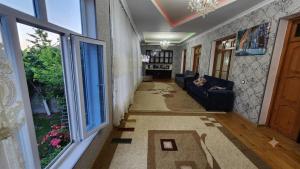 a hallway with a living room with a couch at Sheki Garden Guest House in Sheki +20 photos