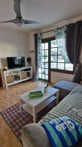 a living room with a couch and a coffee table at Lukite House in Tías