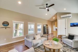 a living room with two couches and a table at Gateway to Glacier! 2-Cabin Compound for Groups in Columbia Falls