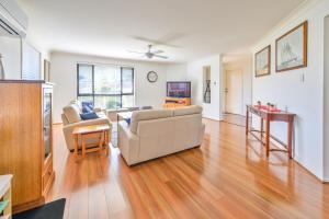a living room with a couch and a table at Lomandra in Evans Head