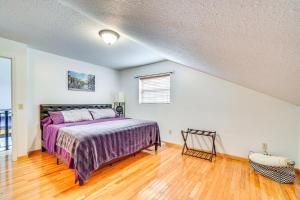a bedroom with a bed and a wooden floor at House & Tiny Cabin! Multi-Acre East TN Property in Englewood