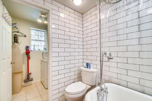 a bathroom with a toilet and a bath tub at House & Tiny Cabin! Multi-Acre East TN Property in Englewood +22 photos