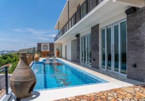 an image of a swimming pool in a villa at Galerias Oaxaca Suites in Oaxaca City