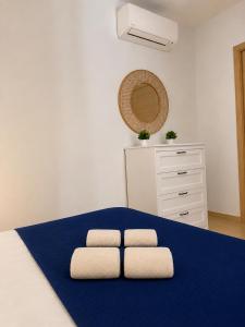a bedroom with two pillows on a bed at Villa Favignana in Favignana