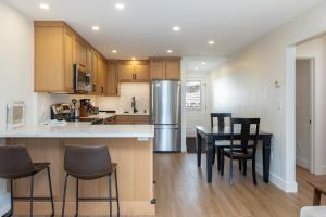 a kitchen and dining room with a table and chairs at Tenmile Creek #215 : 2 in Frisco +15 photos