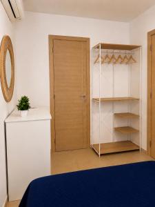 a bedroom with a bed and a closet and a door at Villa Favignana in Favignana +38 photos