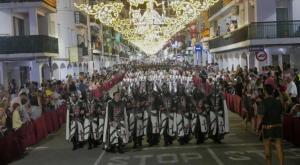 a group of people in uniforms walking down a street at TAJ house center Altea #C in Altea