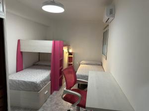a room with two bunk beds and a table at TAJ house center Altea #C in Altea +14 photos