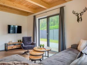 a living room with a couch and a table at Obermöschach 1A in Lake Pressegg