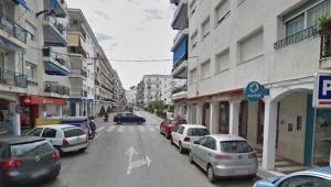 a busy city street with cars parked on the street at TAJ ROOM center altea #D in Altea