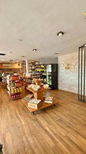 a grocery store with shelves of products in a room at Hotel Peritoró in Peritoró