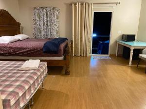 a bedroom with a bed and a table and a desk at WM Private master suite with separate entry in San Jose
