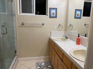 a bathroom with two sinks and a shower at WM Private master suite with separate entry in San Jose +2 photos