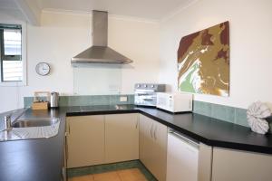 a kitchen with a sink and a counter top at Spectacular Views, Convenient, Affordable - KK17129 in Kaikoura