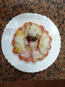 a white plate of food on a table at Hotel Sicarú in Chapulco