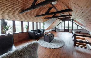 a living room with a couch and a chair at Villa Kalle in Åstorp