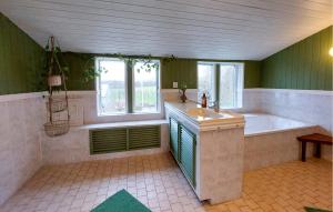 a large bathroom with a tub and a sink at Villa Kalle in Åstorp +25 photos