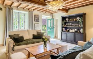 a living room with a couch and a table at Maisons Falourdel in Soulles