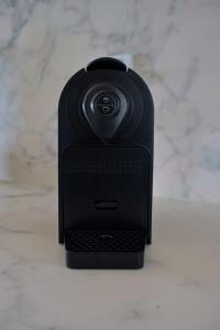 a black cell phone sitting on a counter at La Villa Dolce in Mount Victoria