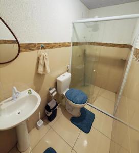 a bathroom with a shower and a toilet and a sink at Flat Vila Mariana in Tianguá +51 photos