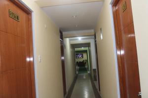 a corridor in a building with a hallway at Balneario del Inca in Los Baños del Inca +45 photos