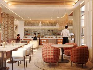 a rendering of a restaurant with tables and chairs at Mercure Hotel Khamis Mushait by Accor in Khamis Mushayt +142 photos