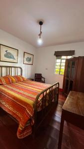 a bedroom with a large bed in a room at Eco Finca El Regalo in Salento +15 photos