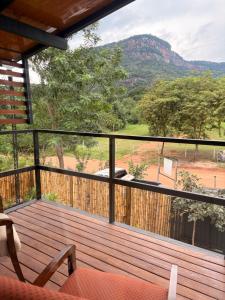 a balcony with a view of a mountain at Villa Iñaru hospedaria in Aquidauana