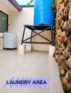a room with a large blue barrel on the wall at D'Rembulan Homestay in Ranau
