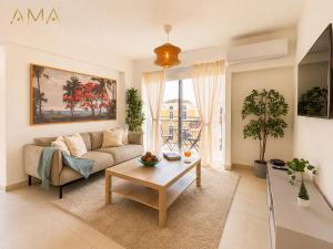 a living room with a couch and a coffee table at Comfortable Central Apartment in Santo Domingo