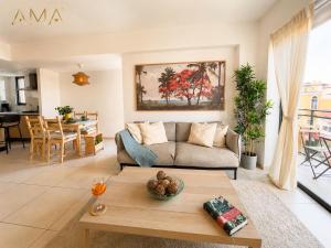 a living room with a couch and a table at Comfortable Central Apartment in Santo Domingo