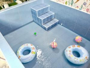 a toy court with two donuts on the floor at Shayus Homestay in Kampong Alor