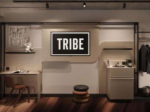 a small kitchen with a table and a refrigerator at TRIBE PARIS SURESNES in Suresnes