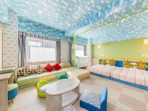 a room with two beds and a table and chairs at HOTEL MYSTAYS PREMIER Sapporo Park in Sapporo +87 photos
