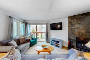 a living room with a couch and a fireplace at Brookhaven B7 in Ludlow