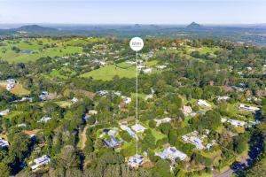 an aerial view of a suburb with a stop sign at Treehaven House & Cottage - Maleny Retreat in Maleny