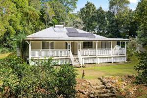 a house with solar panels on the roof at Treehaven House & Cottage - Maleny Retreat in Maleny +47 photos