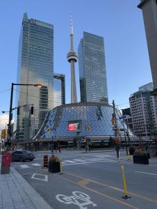 a view of a city with a tower in the background at City Centre Suite, Steps to UofT, TMU, Yonge-Dundas Square in Toronto