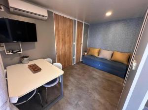 a small room with a couch and a table at Holiday Homes Lavanda - Biograd na Moru in Biograd na Moru