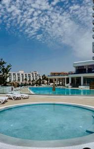 a large swimming pool in front of a building at Ocean View Paradise 1116 in Adeje