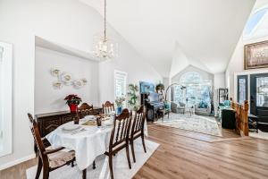 a dining room with a table and chairs at Metta Stays Edgemont in Calgary